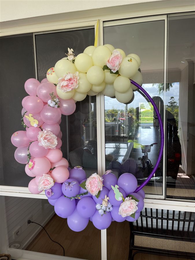 Pastel pink, purple and yellow floral balloon hoop